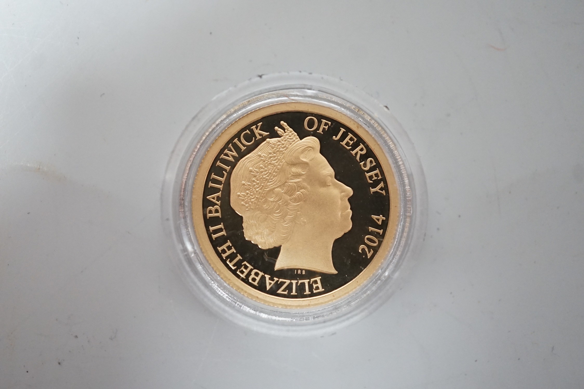 A 2014 Jersey 22ct gold Proof £1 coin, with box and certificate.